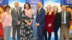 Dr Vitti with staff at press conference 